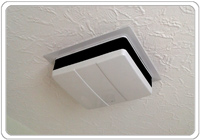 A new extract fan recessed into the ceiling